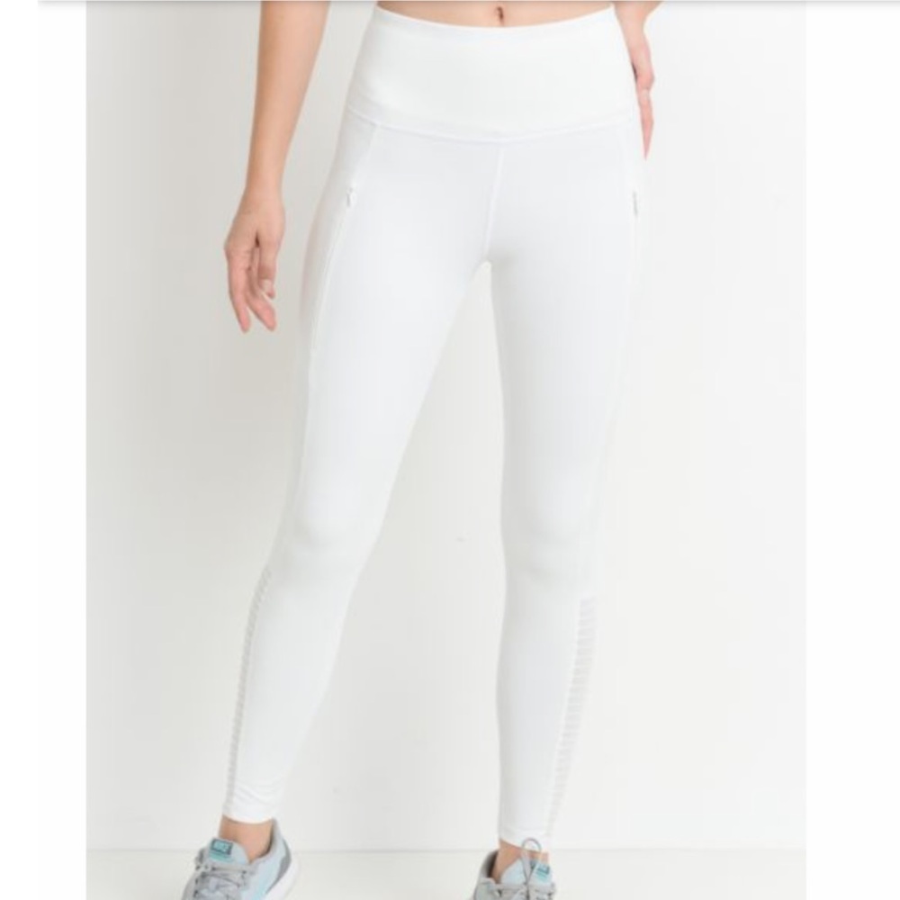 White leggings with zipper pockets